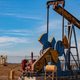 Oil wells in crop field near Arvin, Kern County.